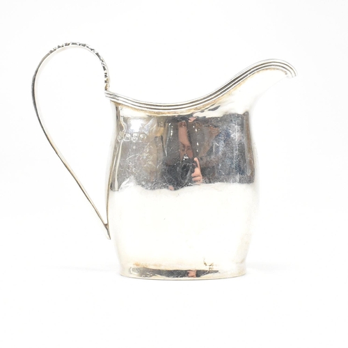 59 - An Edward VII Hallmarked silver creamer. The cream jug having an oval foot base raising to a bulbous... 