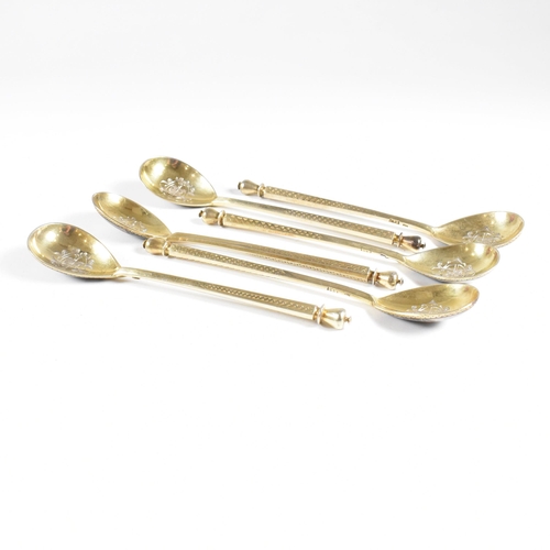 6 - VASILI SEMENOV - A late 19th century cased Russian silver gilt and niello tea service spoon suite. T... 