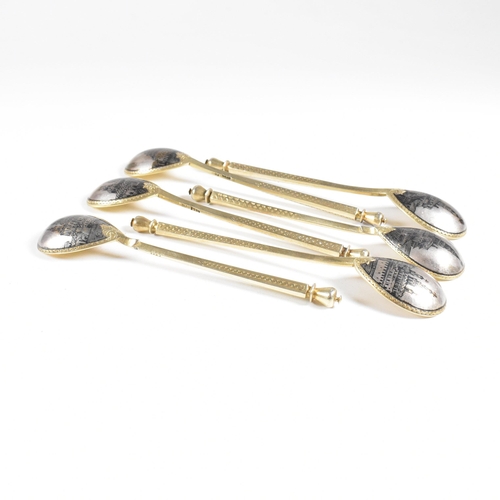 6 - VASILI SEMENOV - A late 19th century cased Russian silver gilt and niello tea service spoon suite. T... 