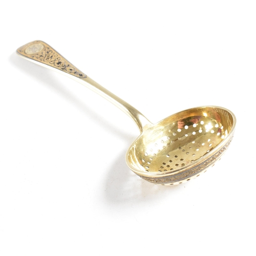 6 - VASILI SEMENOV - A late 19th century cased Russian silver gilt and niello tea service spoon suite. T... 