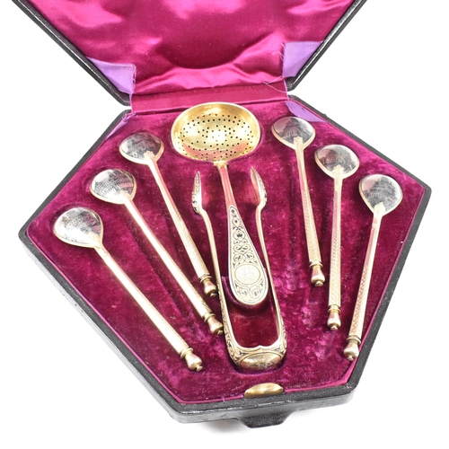 6 - VASILI SEMENOV - A late 19th century cased Russian silver gilt and niello tea service spoon suite. T... 