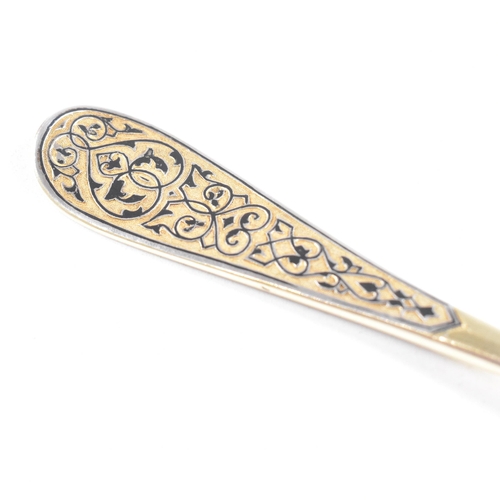 6 - VASILI SEMENOV - A late 19th century cased Russian silver gilt and niello tea service spoon suite. T... 