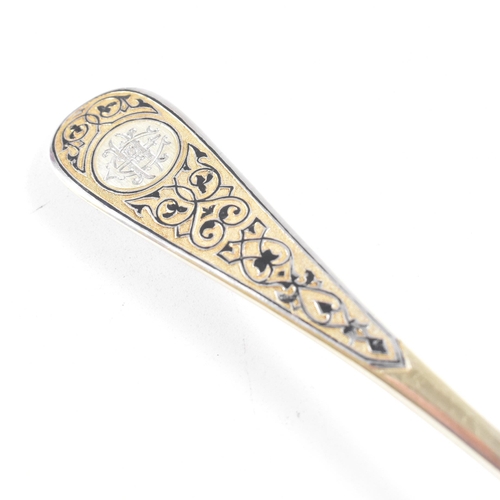 6 - VASILI SEMENOV - A late 19th century cased Russian silver gilt and niello tea service spoon suite. T... 