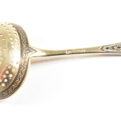 6 - VASILI SEMENOV - A late 19th century cased Russian silver gilt and niello tea service spoon suite. T... 