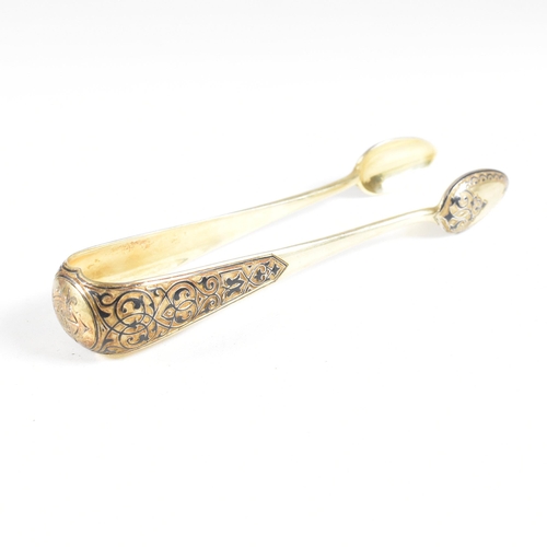 6 - VASILI SEMENOV - A late 19th century cased Russian silver gilt and niello tea service spoon suite. T... 