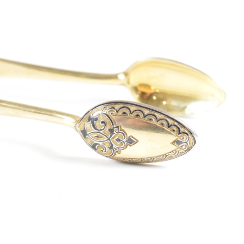 6 - VASILI SEMENOV - A late 19th century cased Russian silver gilt and niello tea service spoon suite. T... 