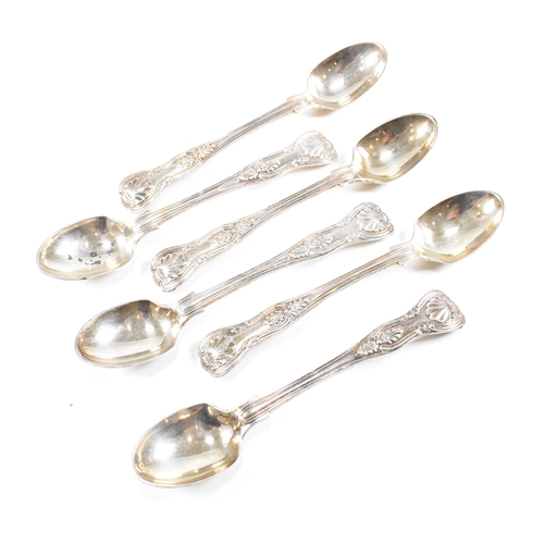 60 - A set of six Victorian hallmarked silver tea spoons. The spoons having a moulded scrolled design wit... 