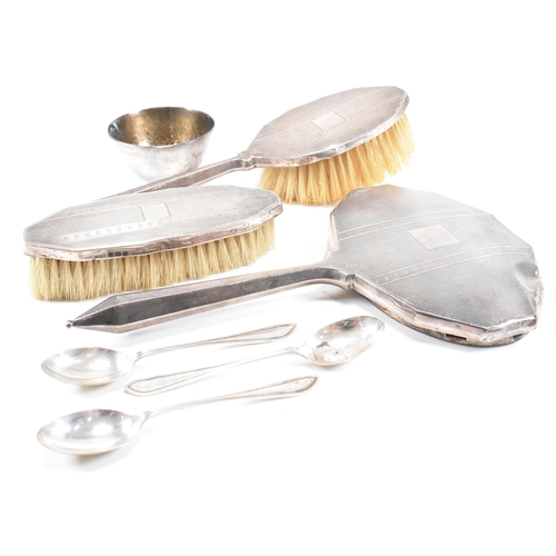 65 - Art Deco hallmarked silver three piece dressing set with silver bowl and spoons. The George V dressi... 