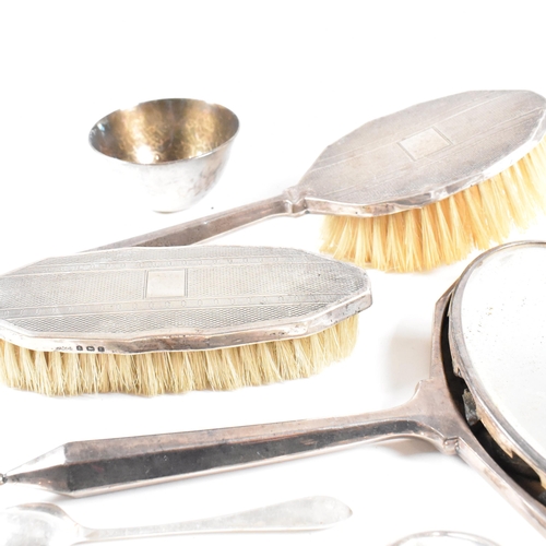 65 - Art Deco hallmarked silver three piece dressing set with silver bowl and spoons. The George V dressi... 