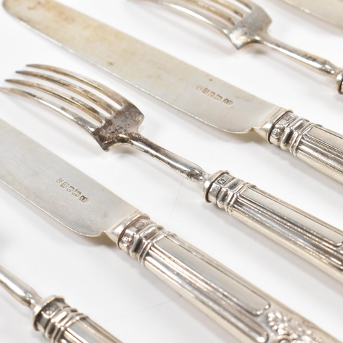 67 - A set of six George IV hallmarked silver dessert knives and forks. The Georgian flatware set having ... 