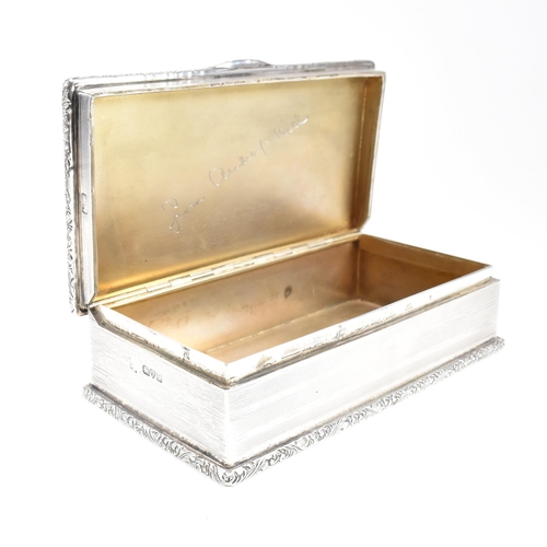 71 - A George V hallmarked silver cigarette box. The Georgian cigar box having an engine turned design to... 