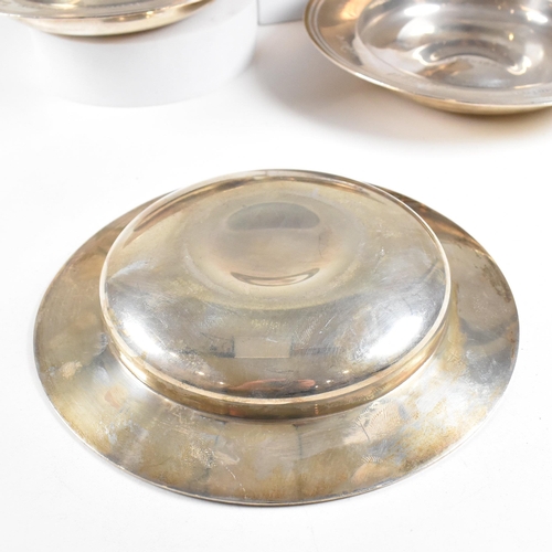 72 - A set of four mid-century hallmarked silver presentation dishes. Each having central inscription 'Ch... 