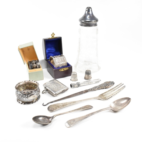 80 - A collection of hallmarked silver items. The lot to include an Edward VII cased napkin ring of octag... 