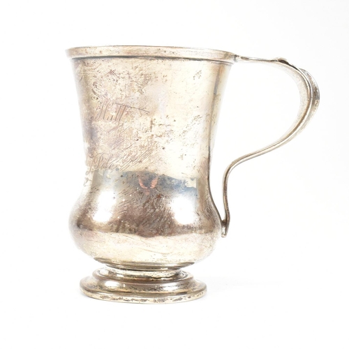 84 - George V hallmarked silver trophy cup. The cup having a circular stepped plinth base raising to a bu... 