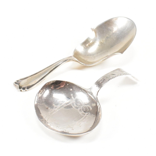 86 - Two hallmarked silver caddy spoons. To include a Georgian caddy spoon having an etched design and va... 