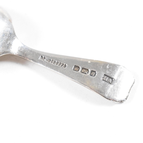 86 - Two hallmarked silver caddy spoons. To include a Georgian caddy spoon having an etched design and va... 