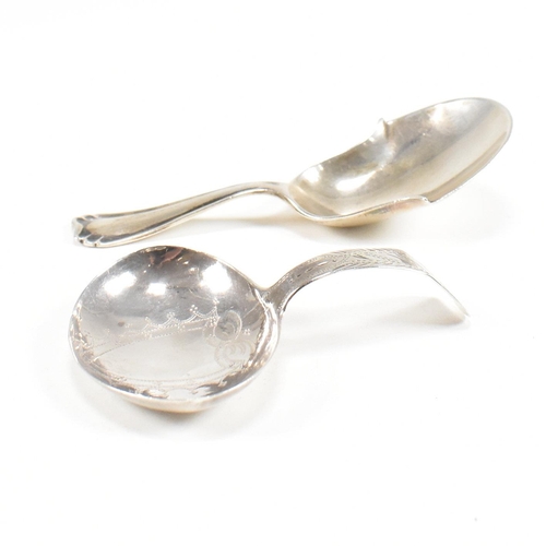 86 - Two hallmarked silver caddy spoons. To include a Georgian caddy spoon having an etched design and va... 