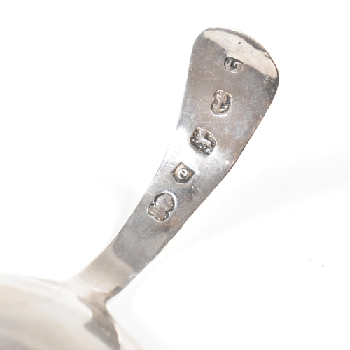 86 - Two hallmarked silver caddy spoons. To include a Georgian caddy spoon having an etched design and va... 