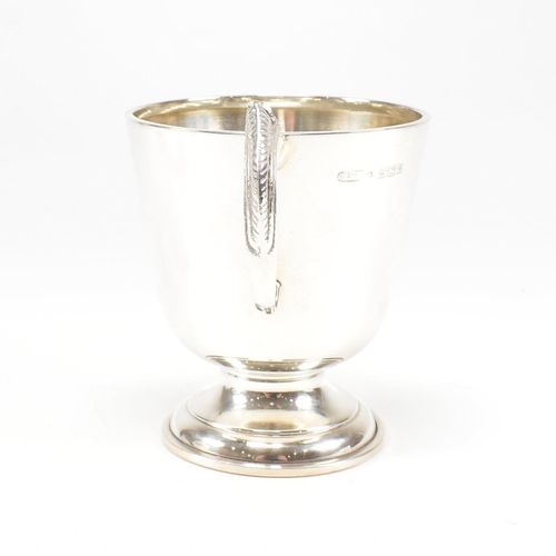 92 - A mid century hallmarked silver Christening cup. Hallmarked for Birmingham, 1963. Makers mark CBros ... 