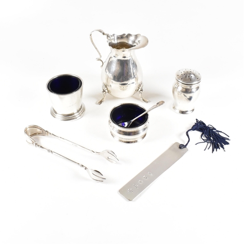 95 - A collection of hallmarked silver items. The lot to include a Victorian cream jug, salts with fitted... 