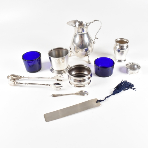 95 - A collection of hallmarked silver items. The lot to include a Victorian cream jug, salts with fitted... 