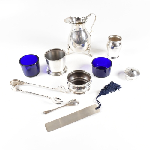 95 - A collection of hallmarked silver items. The lot to include a Victorian cream jug, salts with fitted... 