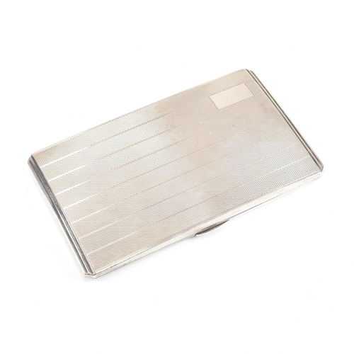 97 - A George VI hallmarked silver cigarette case. The case having an engine turned stripe pattern to the... 