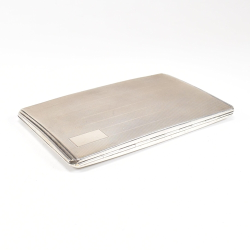 97 - A George VI hallmarked silver cigarette case. The case having an engine turned stripe pattern to the... 