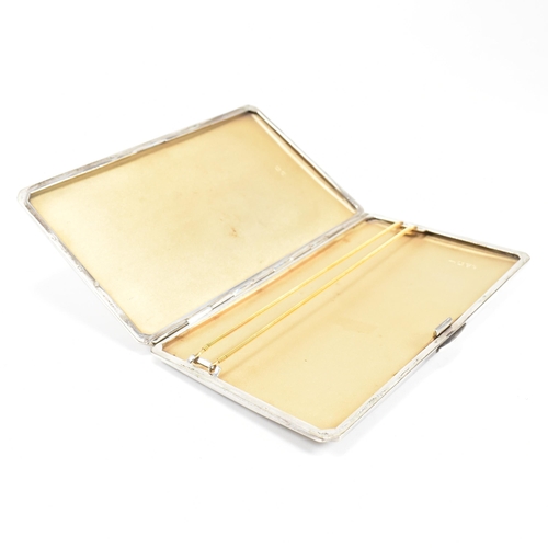 97 - A George VI hallmarked silver cigarette case. The case having an engine turned stripe pattern to the... 