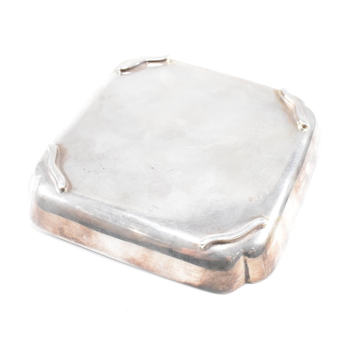 98 - A mid-century hallmarked silver ashtray. The ashtray or trinket dish being ofÿ square form with insc... 