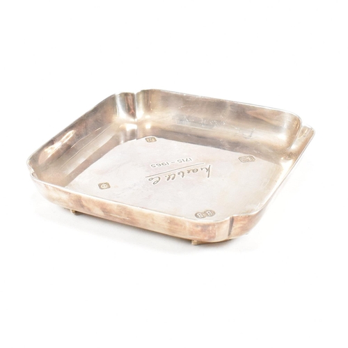 98 - A mid-century hallmarked silver ashtray. The ashtray or trinket dish being ofÿ square form with insc... 