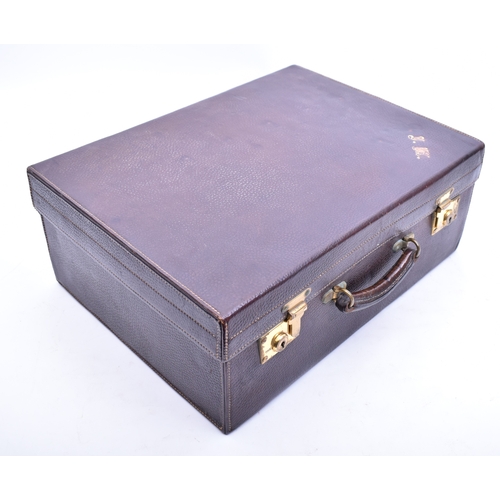 210 - A 1920s hallmarked silver and tortoiseshell leather cased travelling vanity set. The suite to includ... 