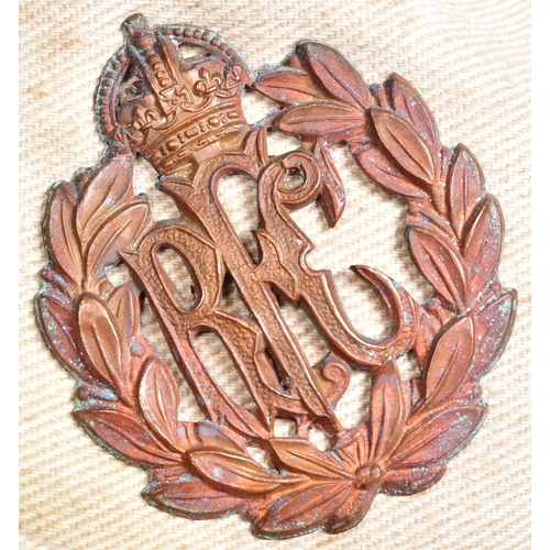 106 - A WWI First World War RFC Royal Flying Corps officers uniform side cap. The cap bronze cap badge and... 