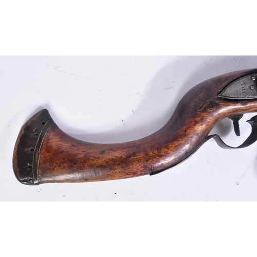 109 - A 19th Century Eastern Flintlock Jezail. The stock having a typical distinct curve, lock plate impre... 