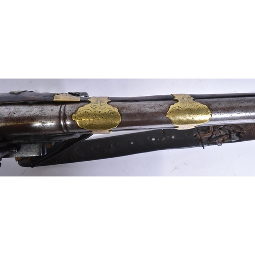 109 - A 19th Century Eastern Flintlock Jezail. The stock having a typical distinct curve, lock plate impre... 