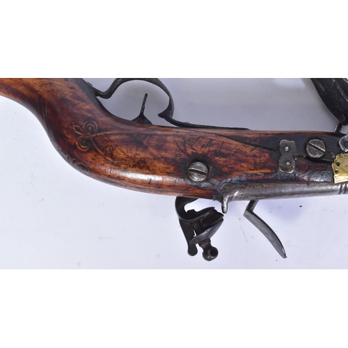 109 - A 19th Century Eastern Flintlock Jezail. The stock having a typical distinct curve, lock plate impre... 