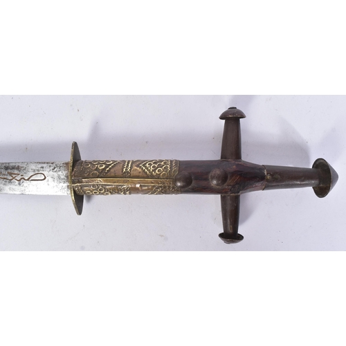 111 - An early 20th Century Berber / Tuareg tribal arm dagger. Dome shaped pommel with a cruciform hilt wi... 