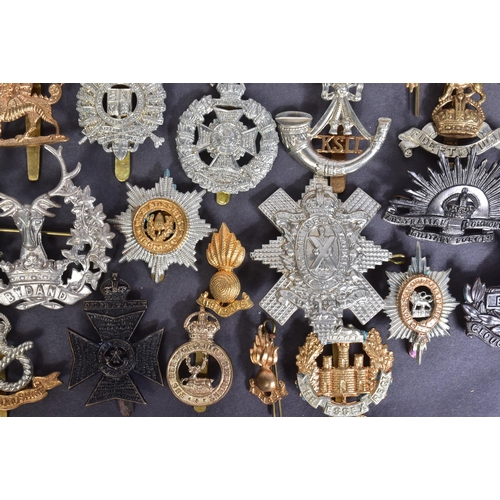 12 - Military Cap Badges - a large collection of assorted period WWI First and WWII Second World War mili... 