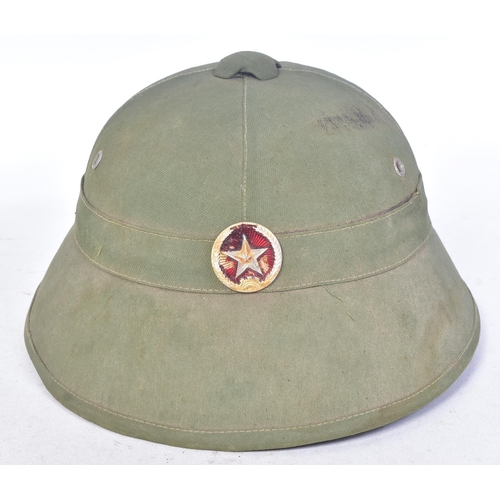 122 - A Vietnam War era NVA North Vietnamese Army helmet. Green pith helmet, fiber mould with cloth adhere... 