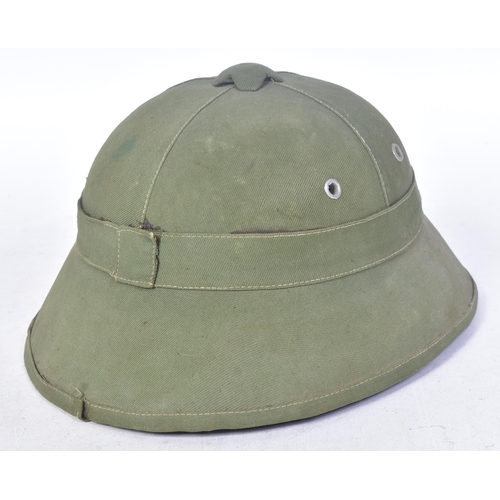 122 - A Vietnam War era NVA North Vietnamese Army helmet. Green pith helmet, fiber mould with cloth adhere... 