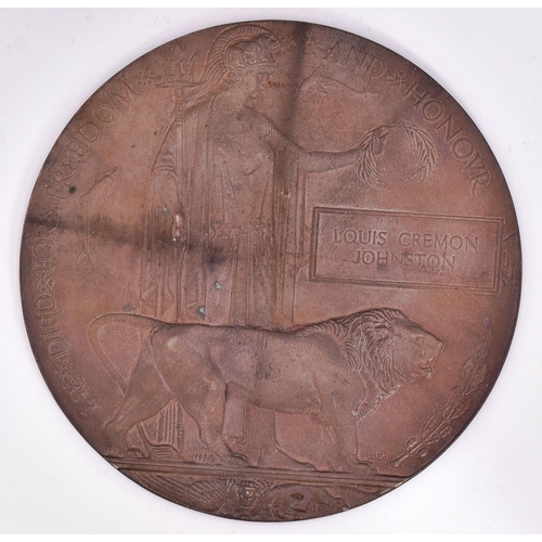 131 - A WWI First World War Death Plaque / Death Penny to one Louis Cremon Johnston. Supplied with its ori... 