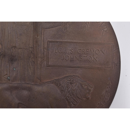 131 - A WWI First World War Death Plaque / Death Penny to one Louis Cremon Johnston. Supplied with its ori... 