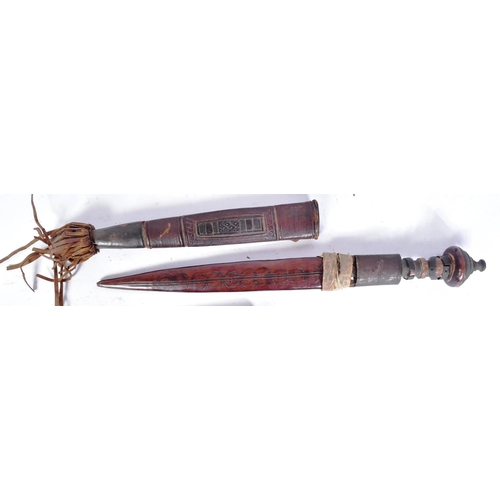 137 - A collection of x4 19th Century African tribal knives / daggers comprising; a pair of matching toole... 