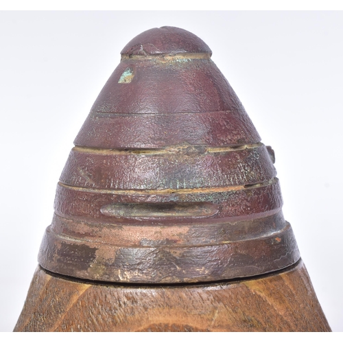 141 - A WWI First World War British 18 Pounder inert shrapnel shell fuse displayed on a wooden plinth. The... 