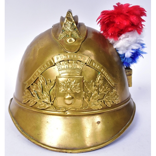 142 - An early WWII Second World War circa 1930 French Fireman's helmet. Brass with split pin ' comb ', tr... 