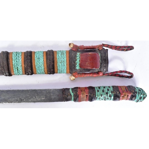 146 - A vintage East African Maasai People tribal seme / machete knife. Plaited leather grip, long taperin... 