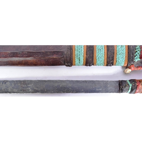 146 - A vintage East African Maasai People tribal seme / machete knife. Plaited leather grip, long taperin... 