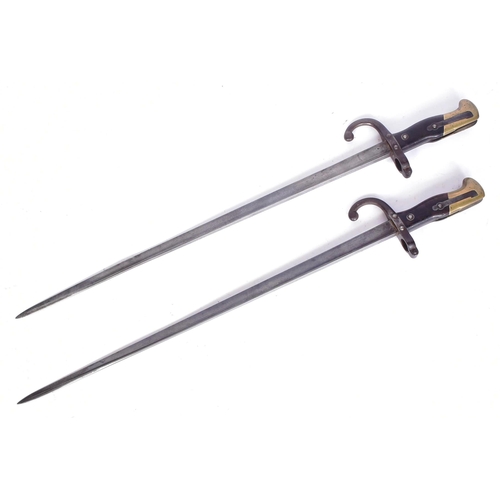 147 - Two 19th Century French 1874 pattern Gras rifle bayonets. The hilt with brass pommel and wooden grip... 