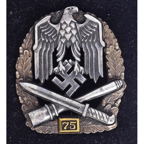 163 - A WWII Second World War Third Reich Nazi German 75 General Assault badge. The badge with oak leaf bo... 