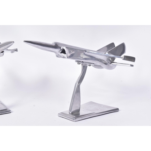 184 - Two vintage chrome metal models of military aircrafts / fighter jets. Each measuring approx 23x40cm.